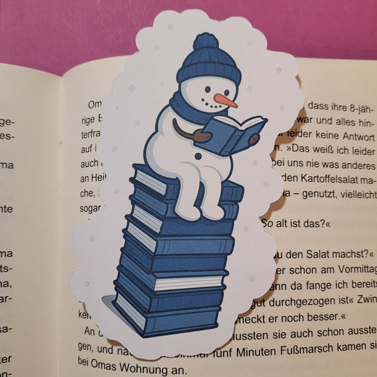 Form-Lesezeichen „Snowy, der lesende Schneemann“